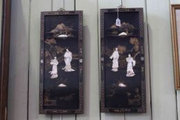 Pair of Oriental lacquered panels with applied decoration