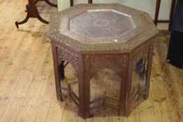 Indian carved octagonal occasional table, 19th Century, with enamelled and pierced tray inset, 77.