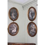 Set of four monochrome oval prints in gilt frames