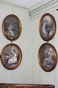 Set of four monochrome oval prints in gilt frames