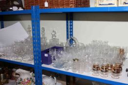 Wicker basket and collection of glassware including decanters