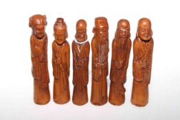 Collection of six carved wood immortals,