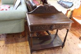 Jacobean style oak hall table, with mask carved pediment and drawer,