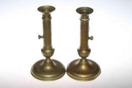 Pair of brass push-up candlesticks,