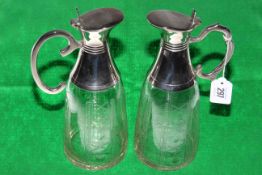 Two silver plated mounted crystal claret jugs,