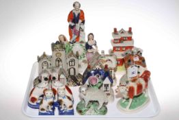 Collection of Staffordshire pottery including cottages and animals