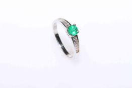 Platinum, round emerald and channel set baguette diamond ring,