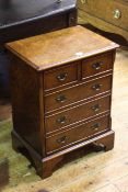 Small Georgian style burr elm chest of two short above three long drawers on bracket feet,