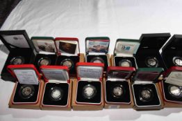 Thirteen Royal Mint 50 pence silver proof coins