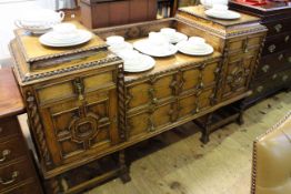 Early 20th Century Jacobean style oak sideboard having sunken centre with two drawers flanked by
