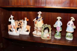 Two pairs of two single Staffordshire figures