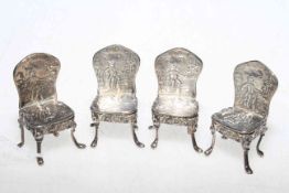Four Continental silver patterned back dolls house chairs