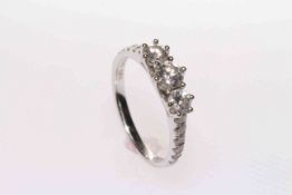 18 carat gold three-stone diamond ring,