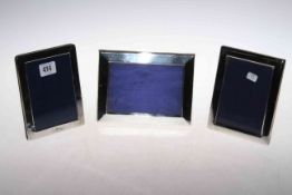 Three silver easel photograph frames