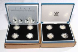 Two Royal Mint silver four-coin pattern sets,