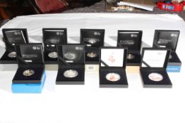 Nine Royal Mint £5 silver proof coins