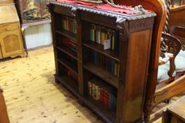 Carved oak open bookcase with five adjustable shelves,