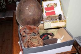 Collection of militaria including helmet, bullet and other belts, badges, armband,