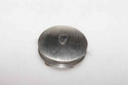 Dutch silver circular snuff box, with engine turned ground centred by a heart motif,