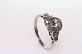 Vintage 1950's platinum, round brilliant diamond ring with baguette diamond shoulders,