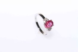 18 carat white gold, oval pink sapphire and baguette diamond ring,
