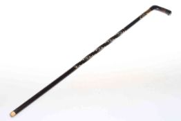 19th Century inlaid and ebonised walking cane, with 18 carat gold plated collar,