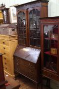 Mahogany Chippendale style bureau bookcase having two glazed panel doors above a fall front with