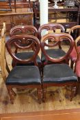 Set of four Victorian mahogany balloon back dining chairs on turned legs