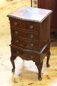 Neat mahogany four drawer serpentine front chest on cabriole legs,