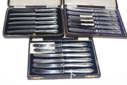 Three cases of silver handled tea knives