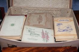 Suitcase of cigarette card albums and books