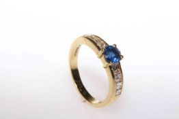 18 carat yellow gold, round sapphire and channel set princess cut diamond shoulder ring,