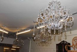 Three eight branch ornate glass chandeliers and three spotlights