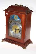German mantel clock with moon aperture and brass feet