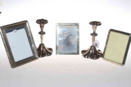 Three silver mounted photograph frames and pair Sheffield plate candlesticks