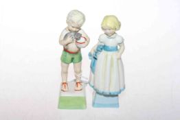 Two Royal Worcester children figures 'Monday' and 'Fridays' child