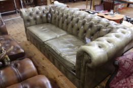 Deep buttoned leather and studded Chesterfield settee