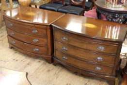 Pair Georgian style inlaid mahogany bow front chests having slide above three long drawers on ogee