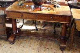 Victorian mahogany two drawer side table on turned tapering pillars and bun feet,