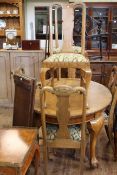 Early 20th Century medium oak oval extending dining table with two leaves and winder on ball and