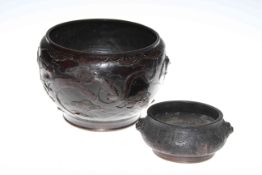 Large and small embossed bronze bowls