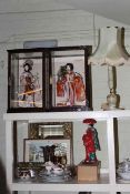 Four Oriental dolls, two in glazed cases, onyx table lamp, mirror, pictures,