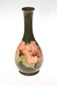 Moorcroft Pottery vase decorated with hibiscus on green ground