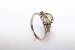 vintage 1950's platinum, round brilliant diamond ring with baguette diamond shoulders,