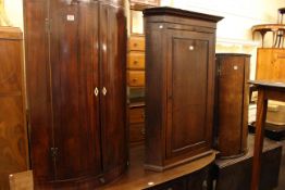 Three 19th Century corner wall cupboards including two bow fronted