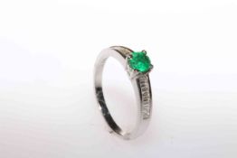 Platinum, round emerald and channel set baguette diamond ring,