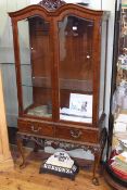 Mahogany china cabinet having two glazed panel doors above two drawers on cabriole legs,