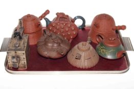Collection of seven redware and pottery teapots