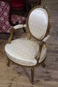Gilt framed French style oval panel back fauteuil