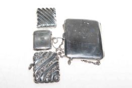 Three silver vesta cases and a silver purse (4)